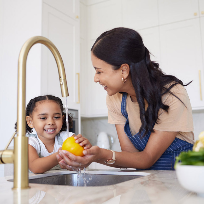Plumbing-540987077-800×800 Mother and daughter washing fruit at kitchen sink
